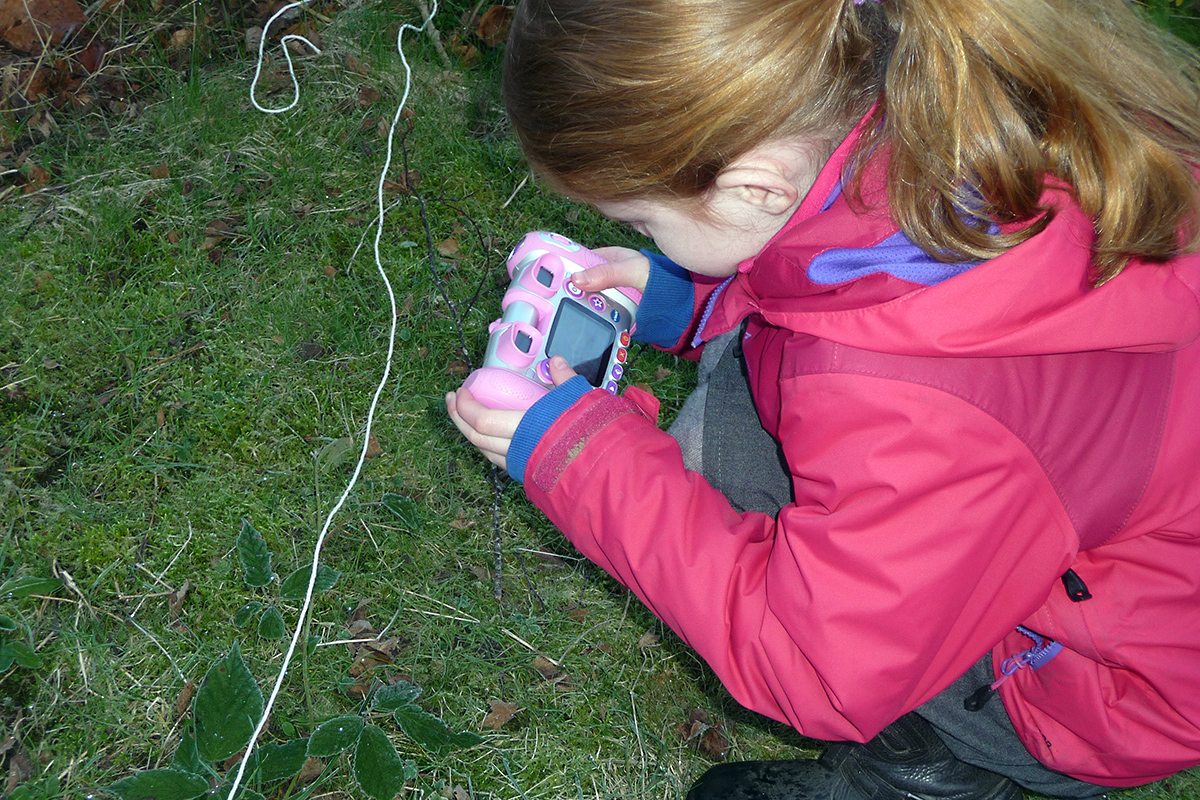 Girl taking a photograph