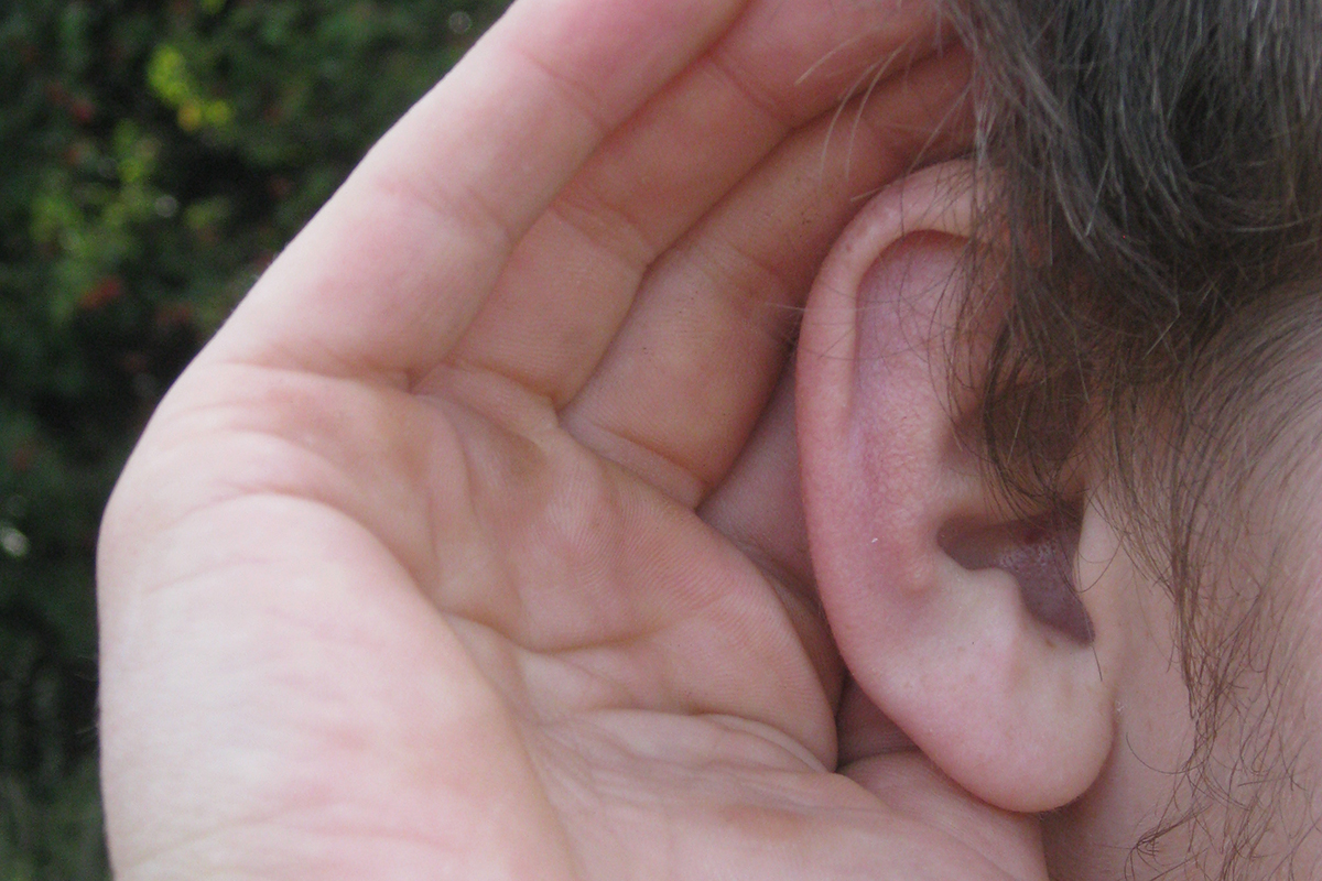 Child cupping their ear