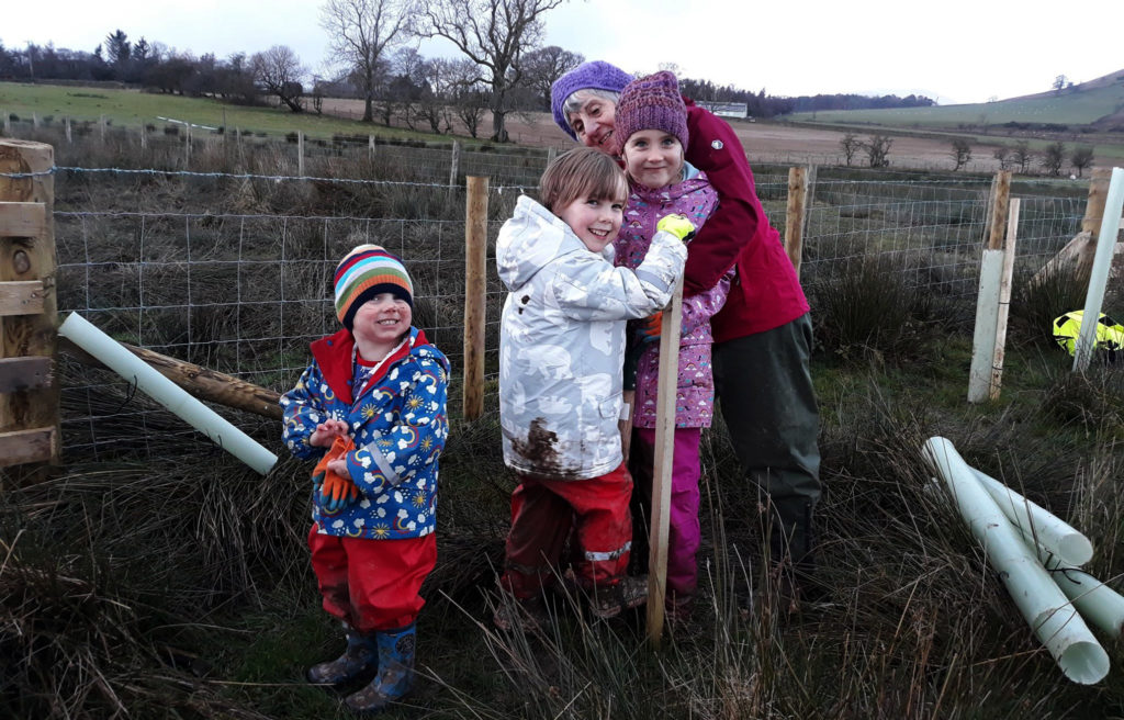 children planting trees