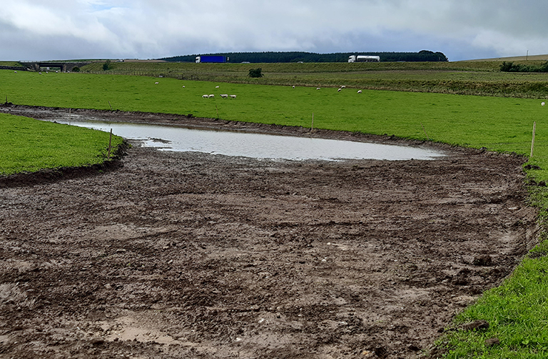 Water flowing down the new river channel for the first time