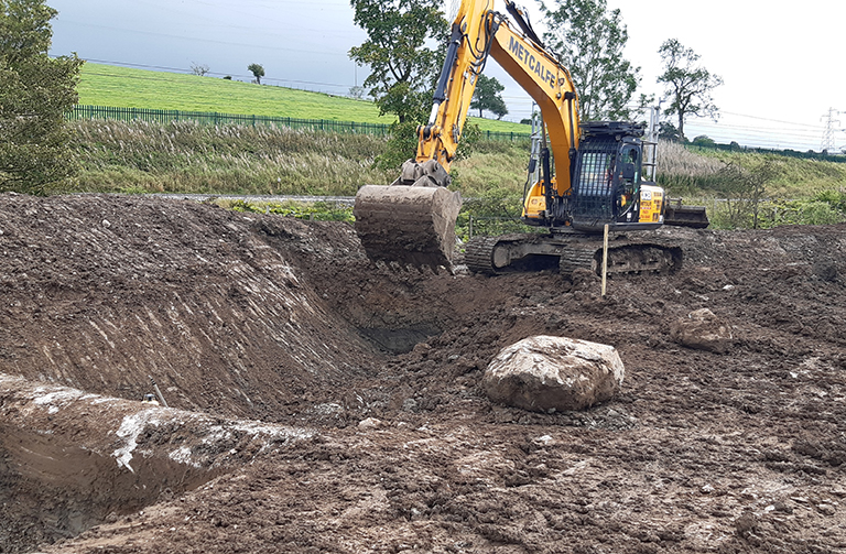 Digger cutting the new river channel