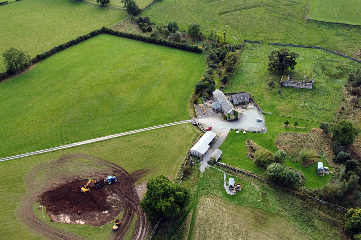 aerial view of farmhouse and new pond