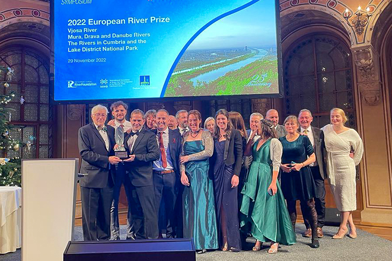 Group of people on stage receiving the European Riverprize